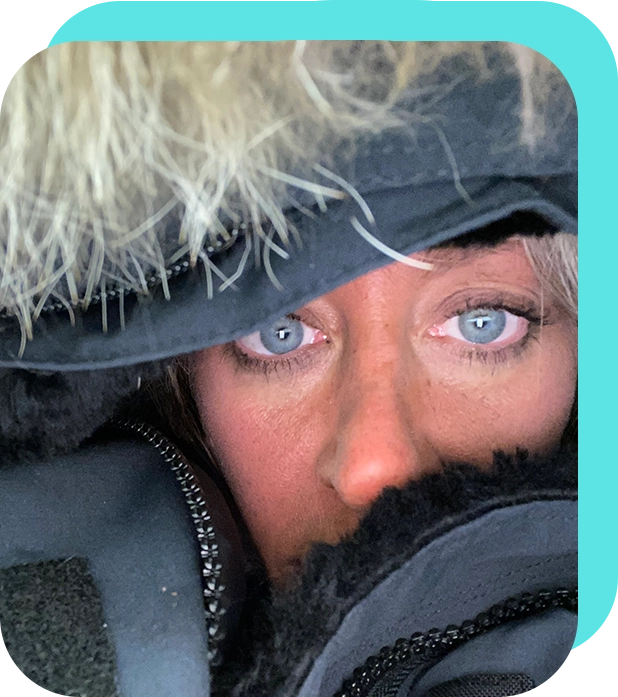 A close up of a person wearing a hat