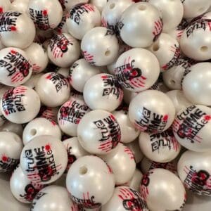 A pile of 20MM True Crime Junky Chunky Bubblegum Beads, 20MM candy bead, 20mm Bubble Gum Beads, 20mm Beads, 4 beads per pack branded with "true Aim" in black and red graffiti-style lettering, featuring a hole on each bead.