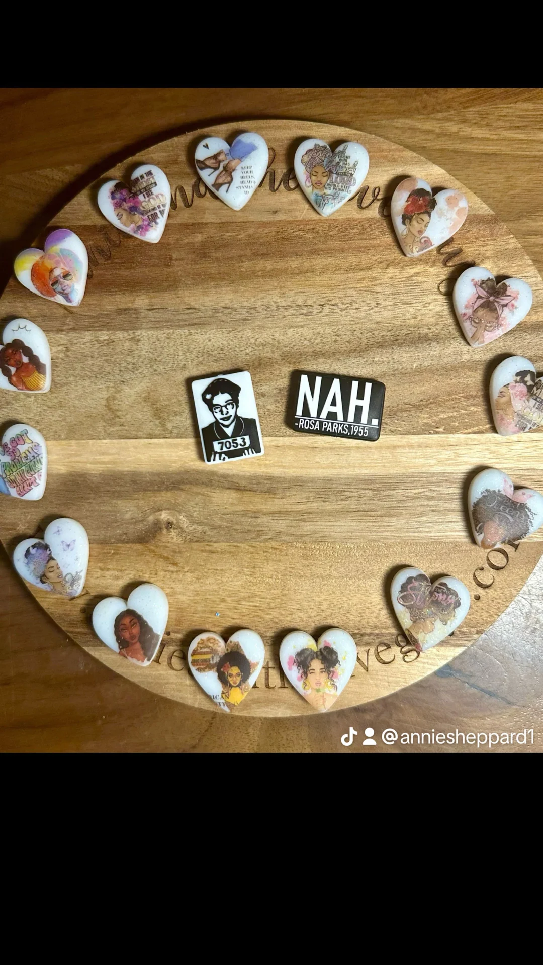 A wooden board displays 16 heart-shaped and two rectangular pins. The rectangular pins feature an image of Rosa Parks and the text "NAH." This setup is credited to anniesheppard1 on TikTok.