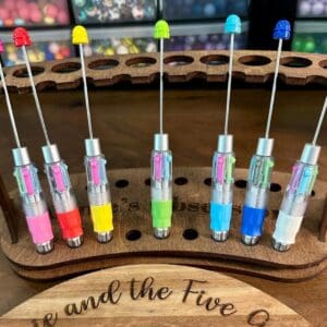 A set of Beadable Multicolor Clicker Pens Multi Ink Pens Multi Pen Retractable pen DIY Ideas for Gift Ideas Teacher Nurse Student Multiple Ink, arranged in a wooden holder.