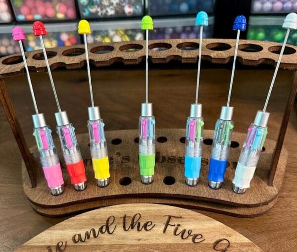 A set of Beadable Multicolor Clicker Pens Multi Ink Pens Multi Pen Retractable pen DIY Ideas for Gift Ideas Teacher Nurse Student Multiple Ink, arranged in a wooden holder.