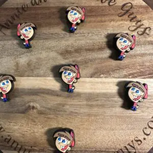 A wooden board with six pins featuring Timothy Turner from Fairly Odd Parents, sporting a pink hat and a smile. The board reads "Annie and the Five Guys" and shows the website www.annieandthefiveguys.com.