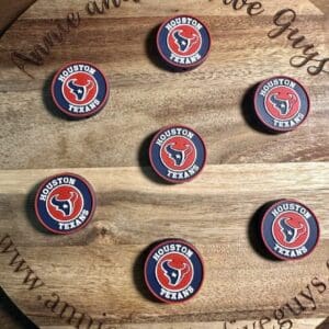 Round wooden board featuring seven Houston Texans Football silicone focal beads arranged in a circular pattern. The board is inscribed with "Annie and the Five Guys" and "www.annieandthefiveguys.com.